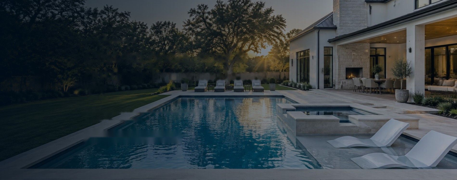 Luxury backyard pool and spa at dusk
