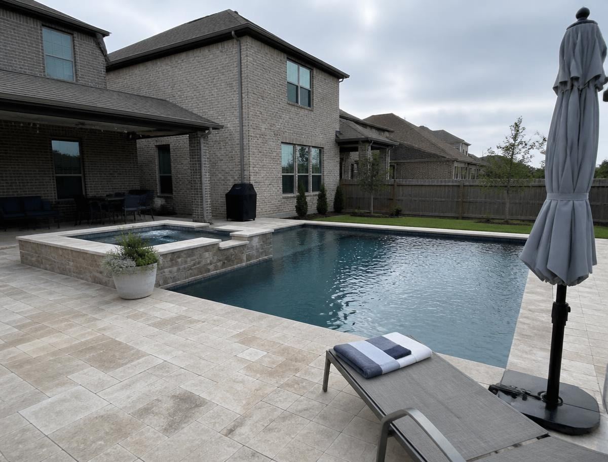 Modern Dallas pool with a raised spa