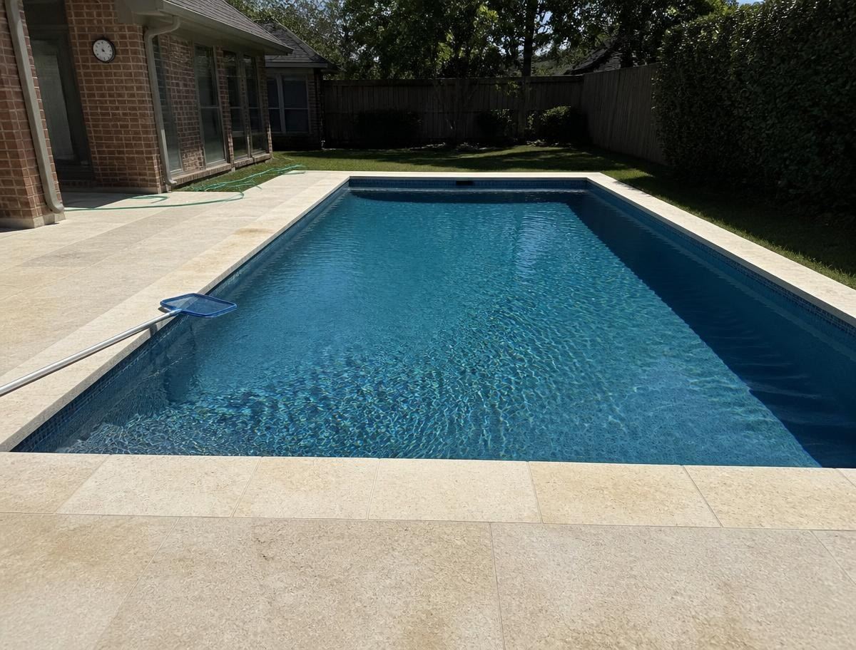 Finished rectangular pool at a Dallas brick home
